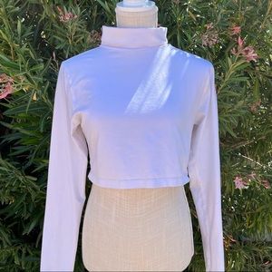 white shrunken crop turtleneck with thumbhole detail